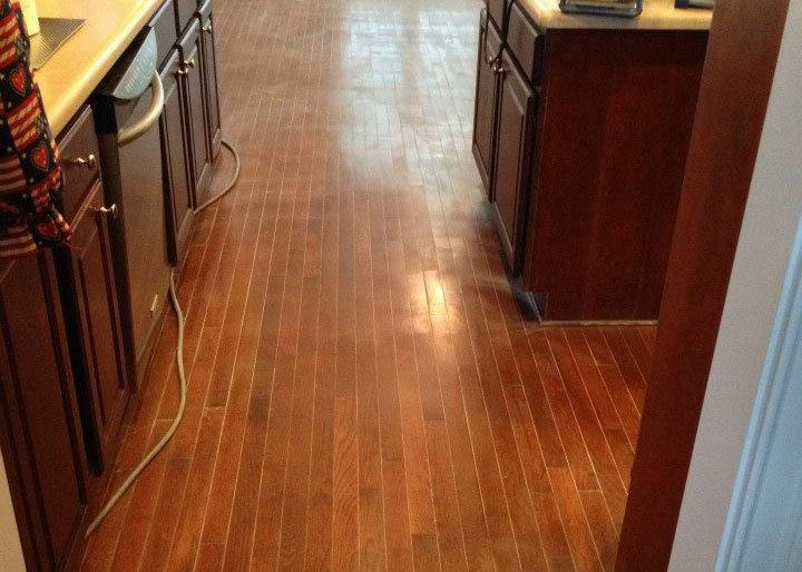 a damaged kitchen floor in need of restoration
